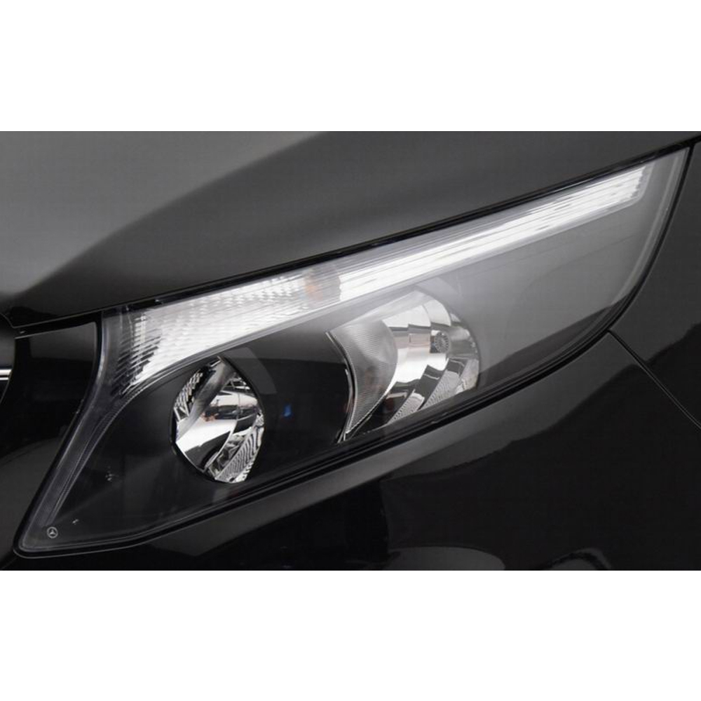 the headlight lens cover has been installed on a car and enlarged to seen clearly