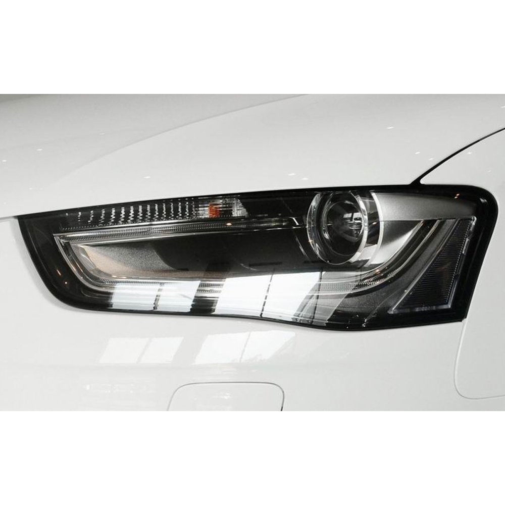 the enlarged headlight lens shade which has been installed on a 2015 year A4 B8PA car
